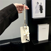 Camellia Flower and Puppy Pearl Charm Leather Crossbody Lanyard Phone Case for iPhone 13 Series